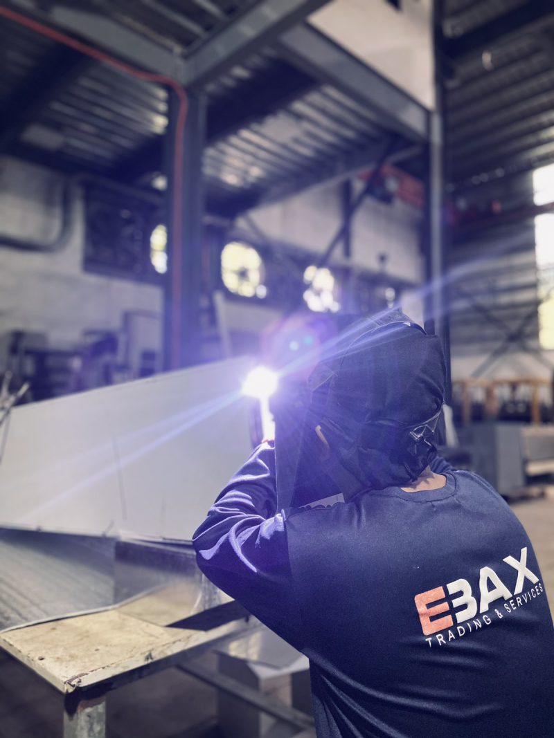 CNC laser cutting machine on the EBAX fabrication floor